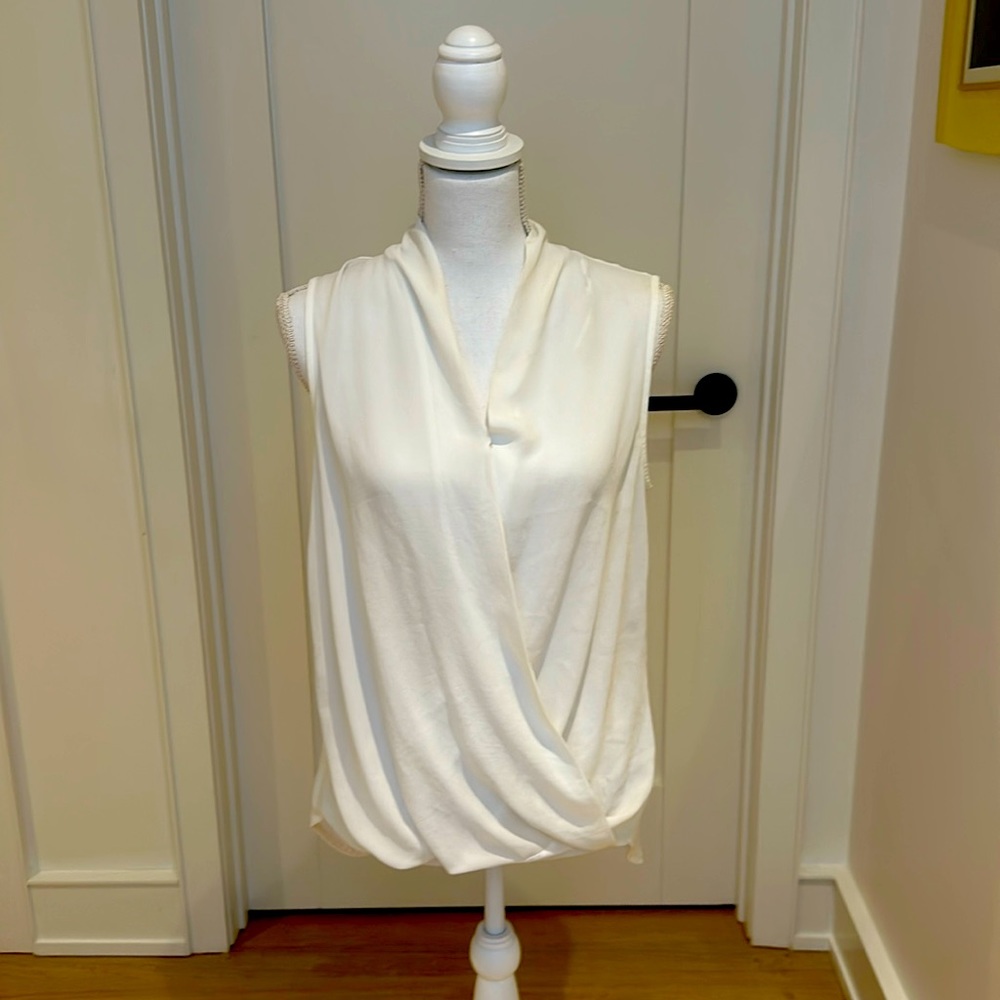 White, sleeveless, drapey blouse with v-neck